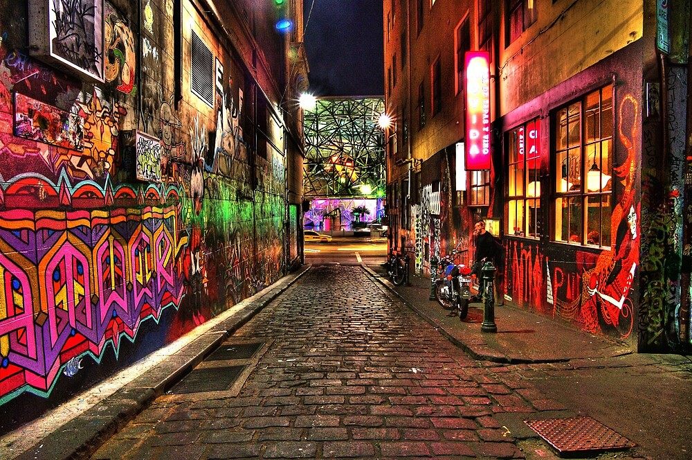 Graffiti-covered cobbled Hosier Lane in Melbourne at night